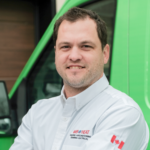 669 Heat technician standing by our famous green trucks in a residential neighbourhood. 669 Heat technician standing by our famous green trucks in a residential neighbourhood.